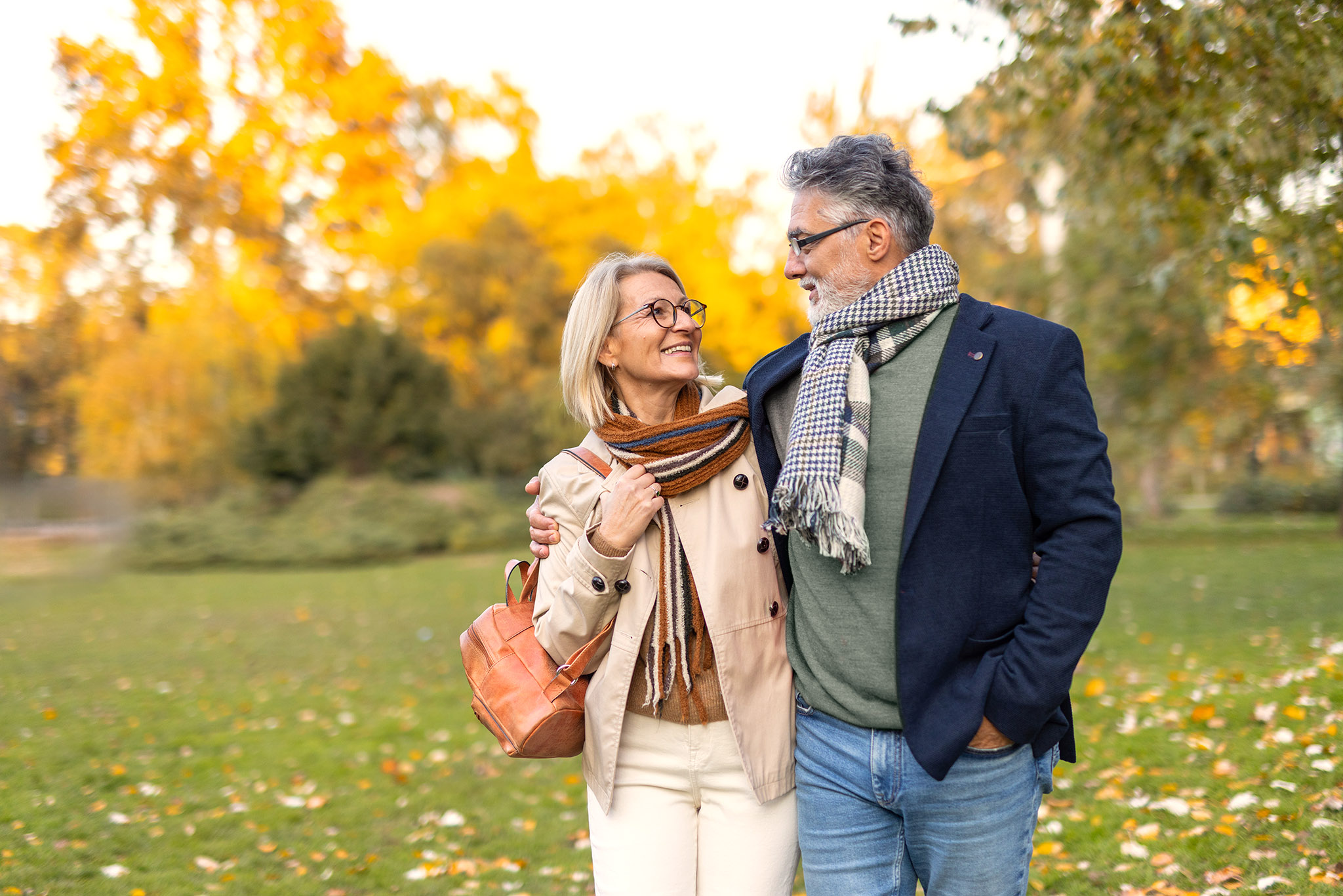 Couple enjoying a beautiful autumn day in the park